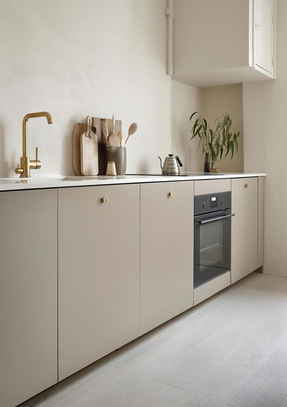 simplistic minimal ikea kitchen cabinetry custom front brass finish