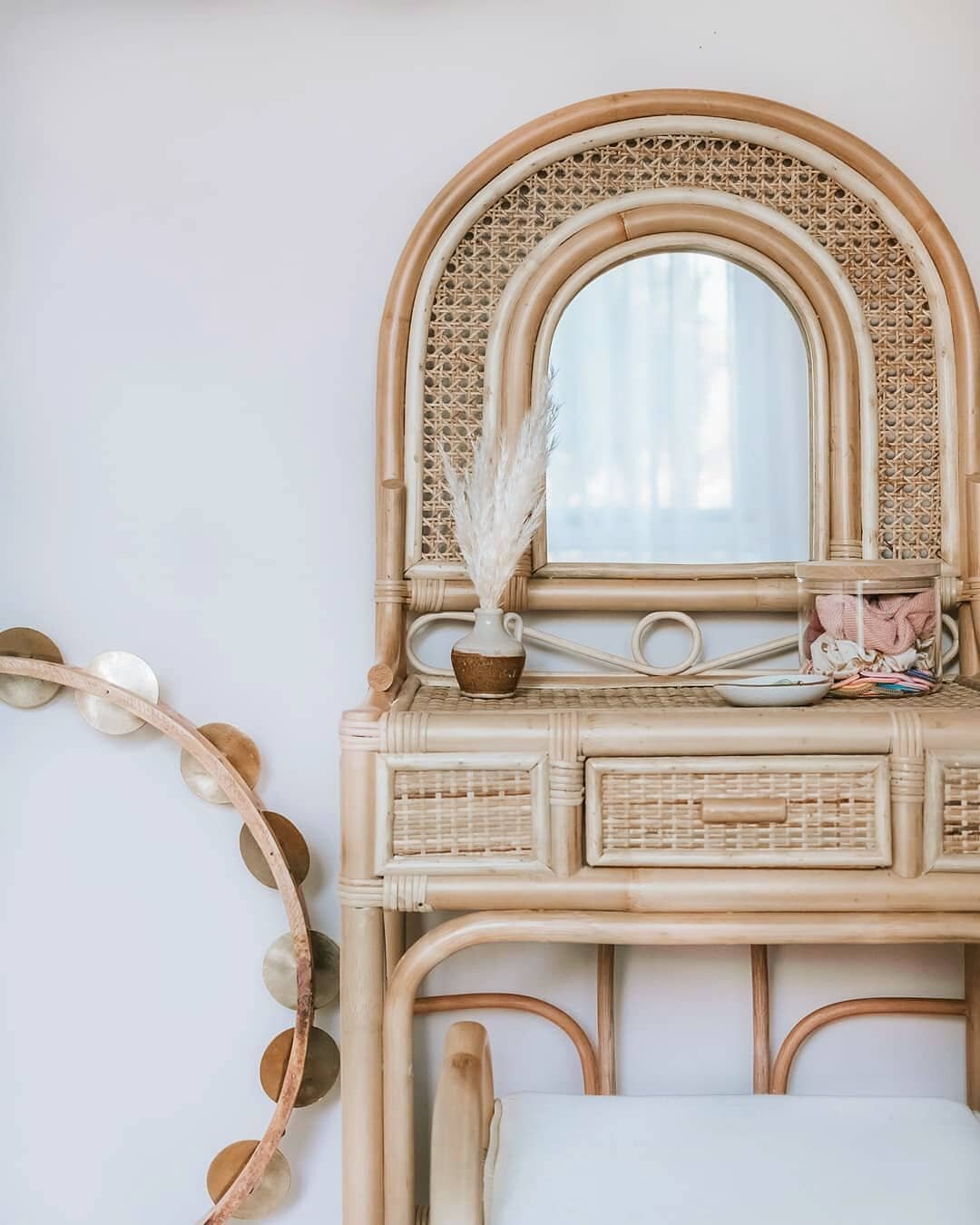 cane and wicker vanity by @everyday.muse