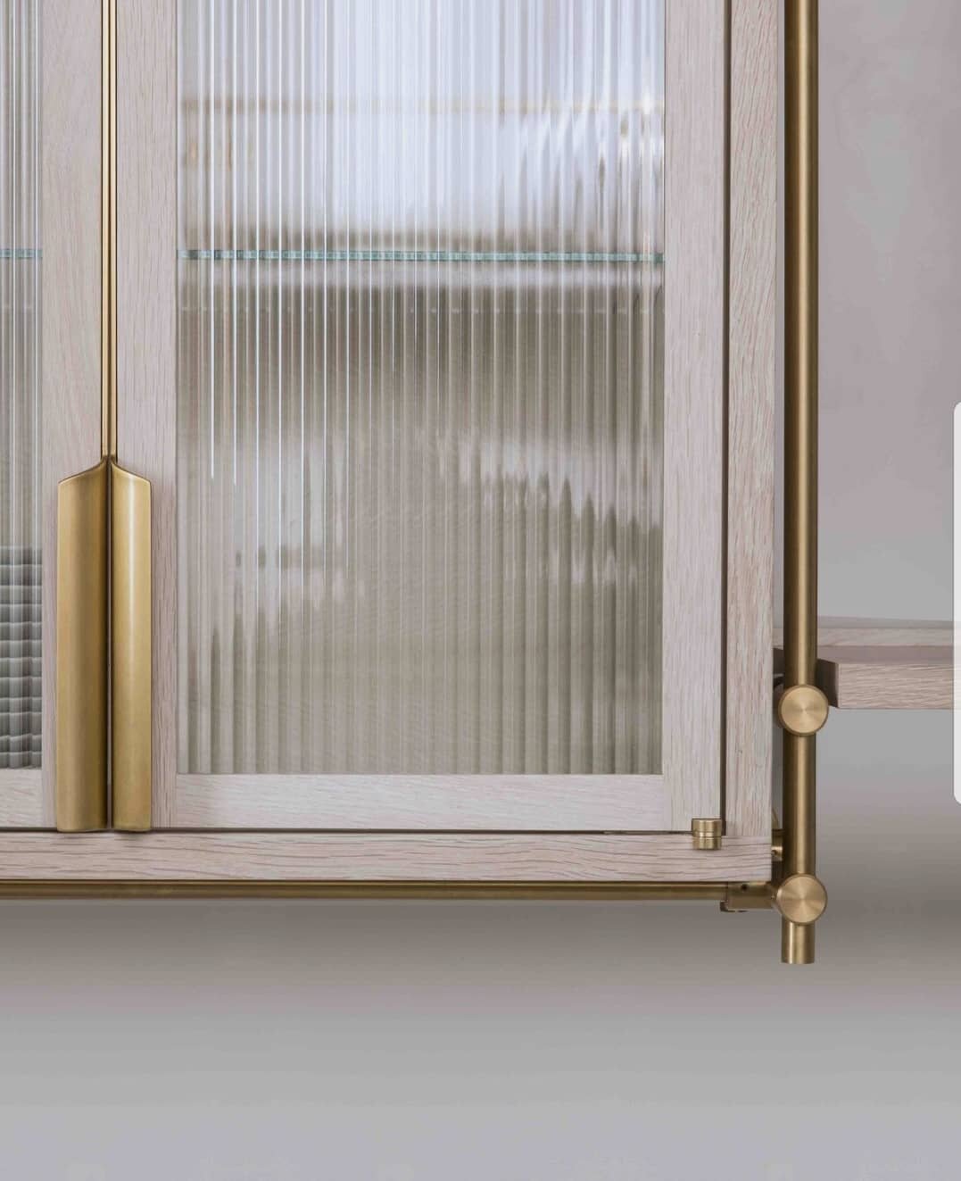 reeded glass cabinet insert with unlacquered brass hardware