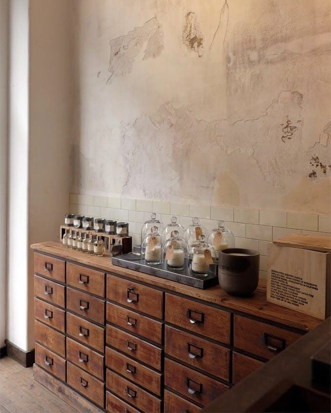earthy plaster neutral wood pull out built in cabinets storage