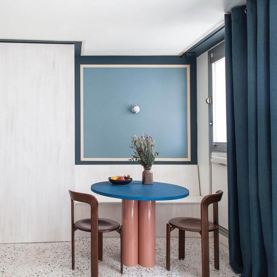natural color table mid century modern natural wood chairs terrazzo chairs blue curtain