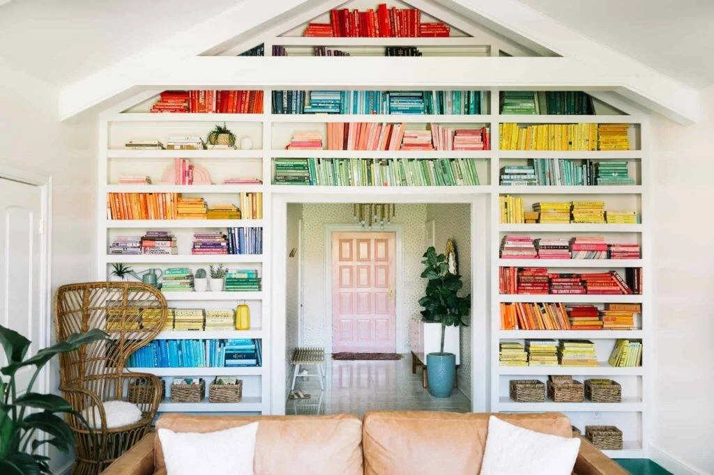 beautiful organized colorful bookshelf