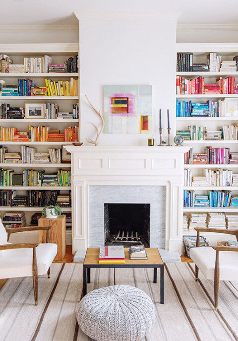 colorful bookshelf styling with fireplace
