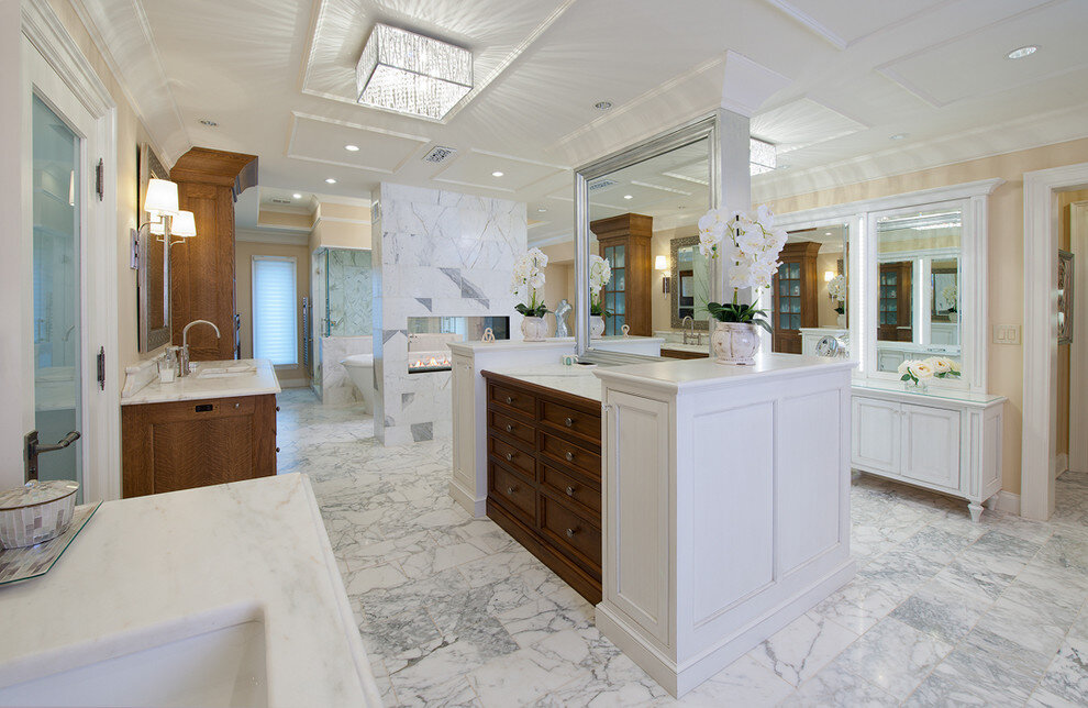 master bath walnut vanity white cabinets carrara marble his hers fireplace