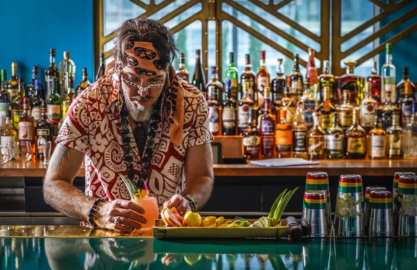 Captain, Brian Miller, preparing one of his delicious tiki cocktails