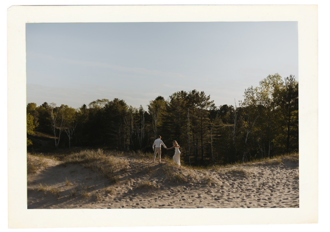 Kohler Andrae State Park Wisconsin Wedding couple walking on beach