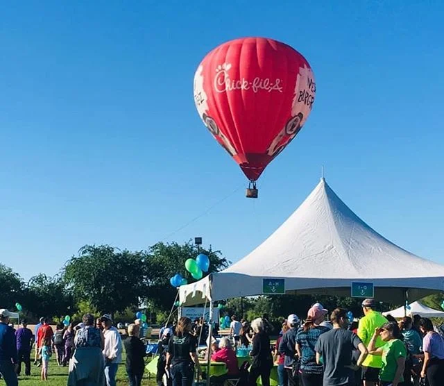 The Chic-fil-a balloon giving tethered balloon rides at a community event. A balloon can be a great community ambassador for your brand while gaining unique and memorable exposure.  #hotairrize #experientialmarketing #hotairballooning #marketing #hot