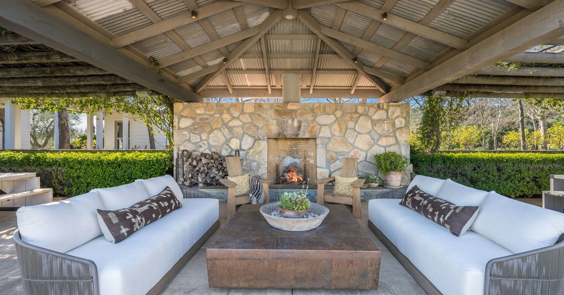 Our current listing at 3075 Dry Creek Road in Napa is designed for extended stays and effortless hosting. With 7K&plusmn; Sq Ft of outdoor entertaining, including this covered lounge area, this property is a place where architecture and landscape wor