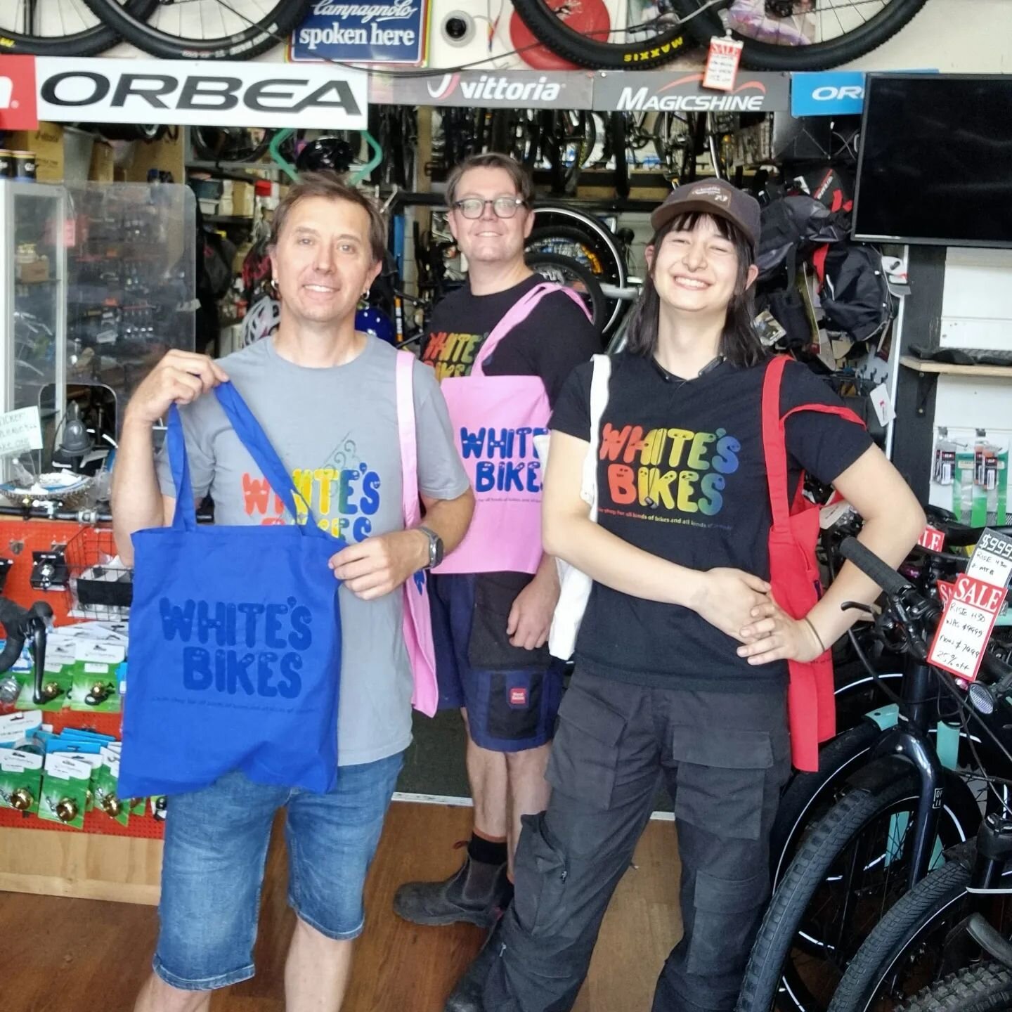 New shop printed totes only in stock in various colours $10, thanks so much @sunnydaisytiedye for making us look fabulous too in our rainbow print staff tshirts. #shoptotes #$10 #tenbucks #variouscoloursavailable💜💙💛💚❤️💖 #variouscolours