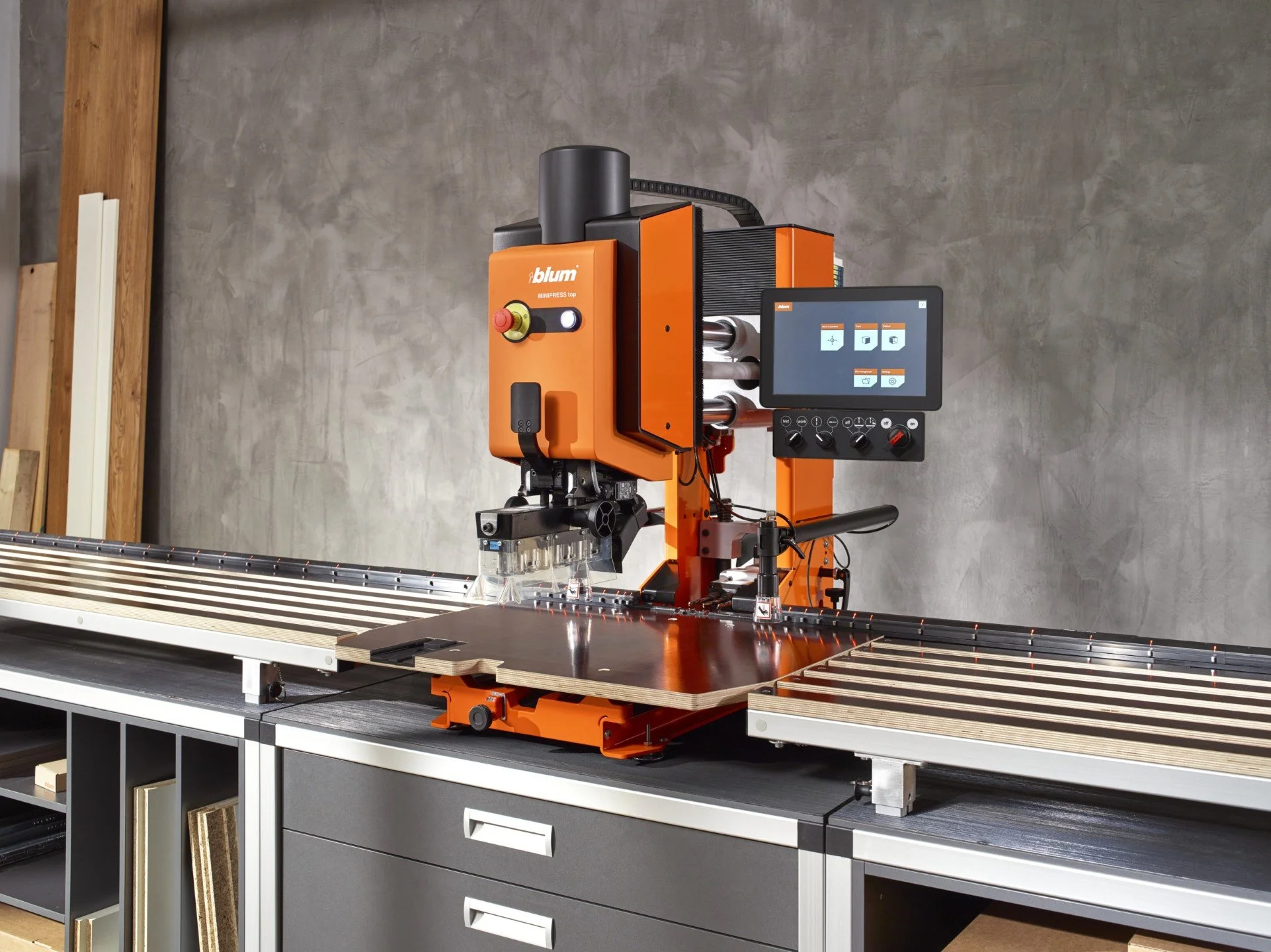 Blum machinery used for precision drilling and hinge installation in kitchen cabinet production