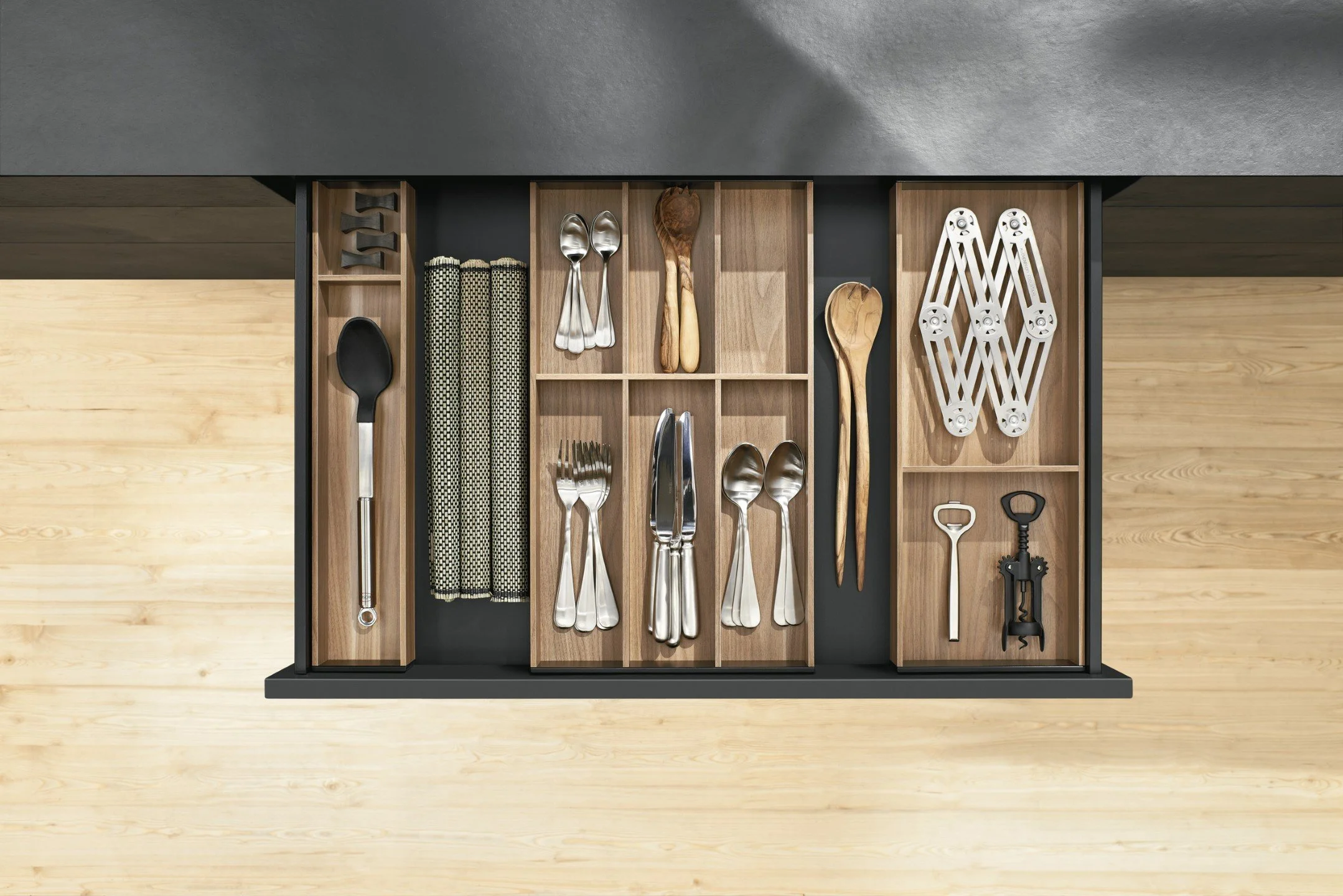 Blum ambiline drawer system divider shown in a drawer by Atlantic kitchens