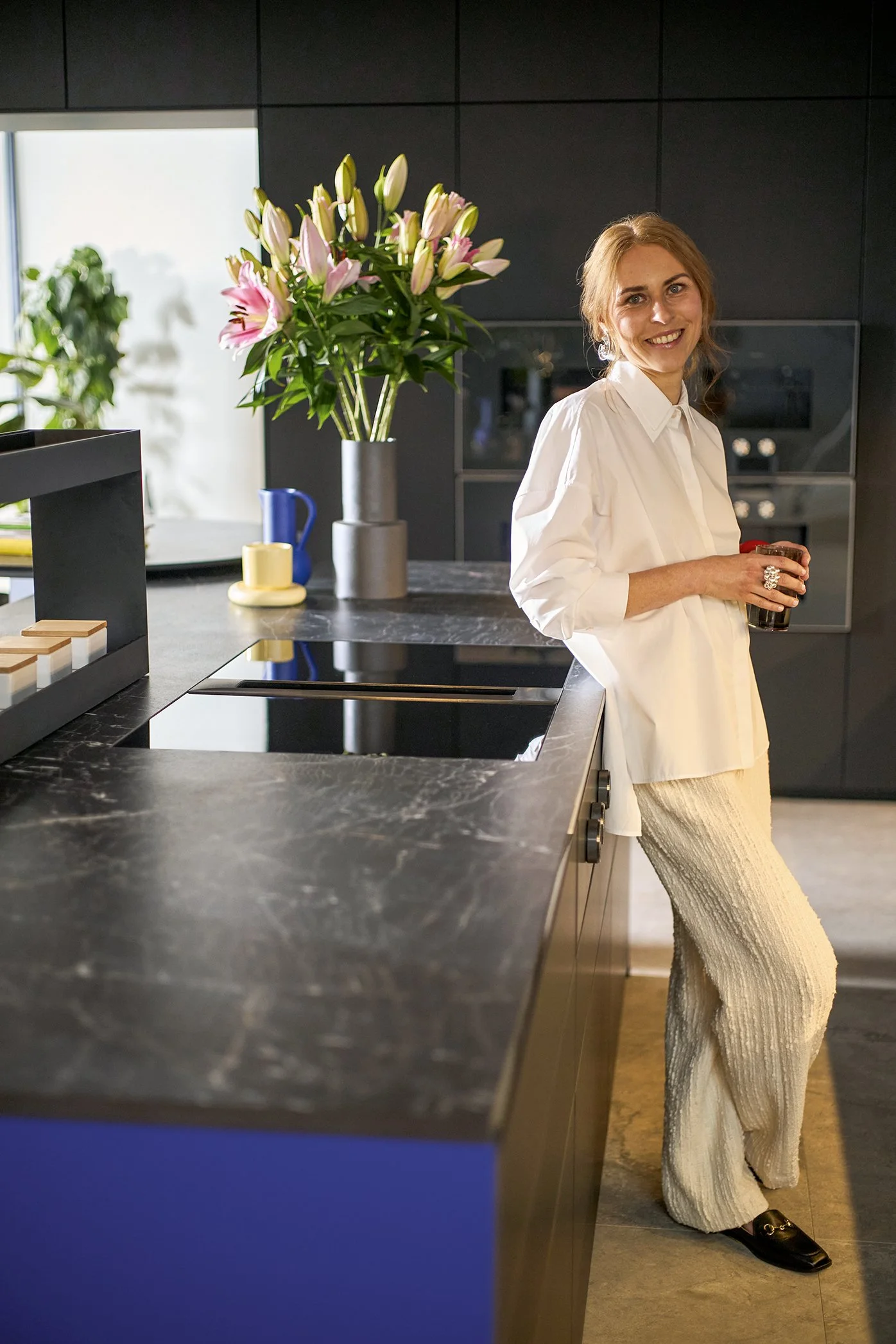 Contact Atlantic Kitchens Norwich to design your own Next125 kitchen – image of ultramarine blue island with ceramic worktop.