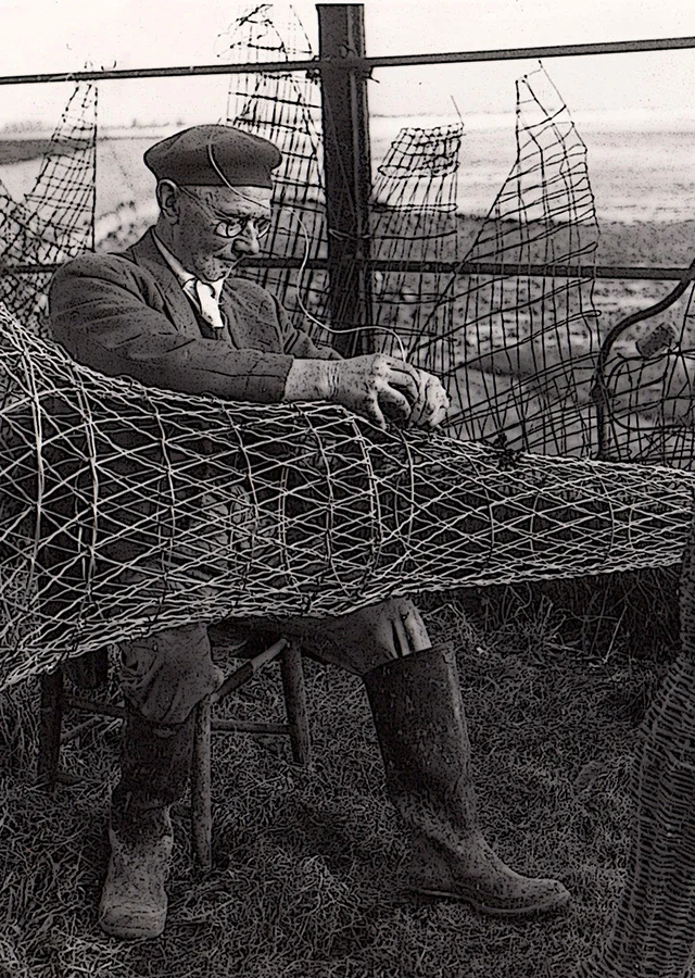 Wyndham Howells repairing putcher nets.