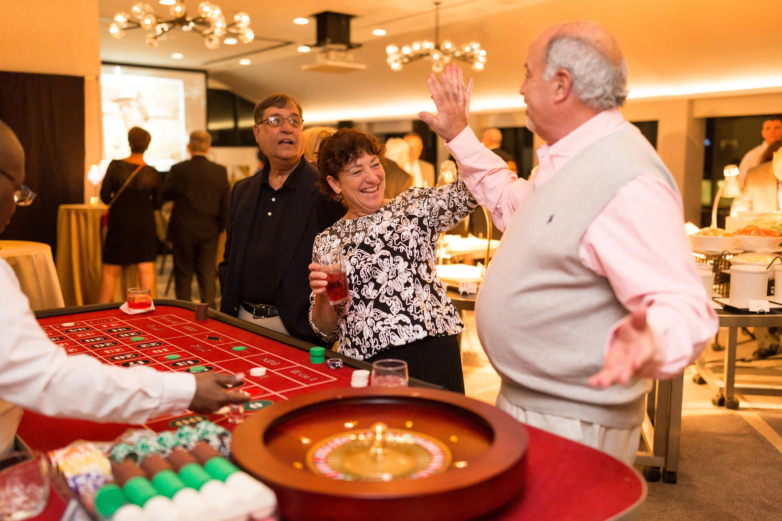 ARJ-productions-DC-area-event-planner-80th-party-casino-high-five.jpg