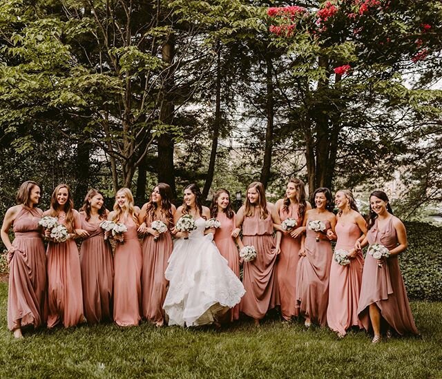 @victoriaheerphotography totally captured the beauty of this bridal party with her dramatic photography. Love the different hues of pinks our bride selected!