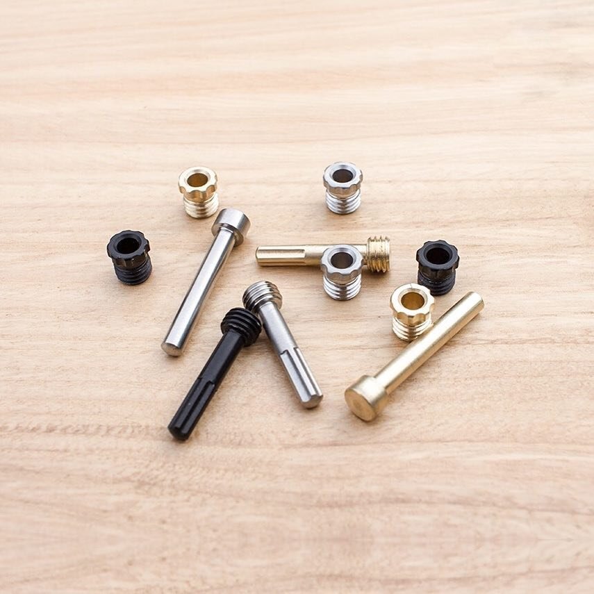 Component parts. We've swapped out knurling on the original pen adjuster and locking nut for neat cut-outs. We found after a couple of years the knurling was wearing down. These cutouts won't wear down, and they provide better grip. They also look co