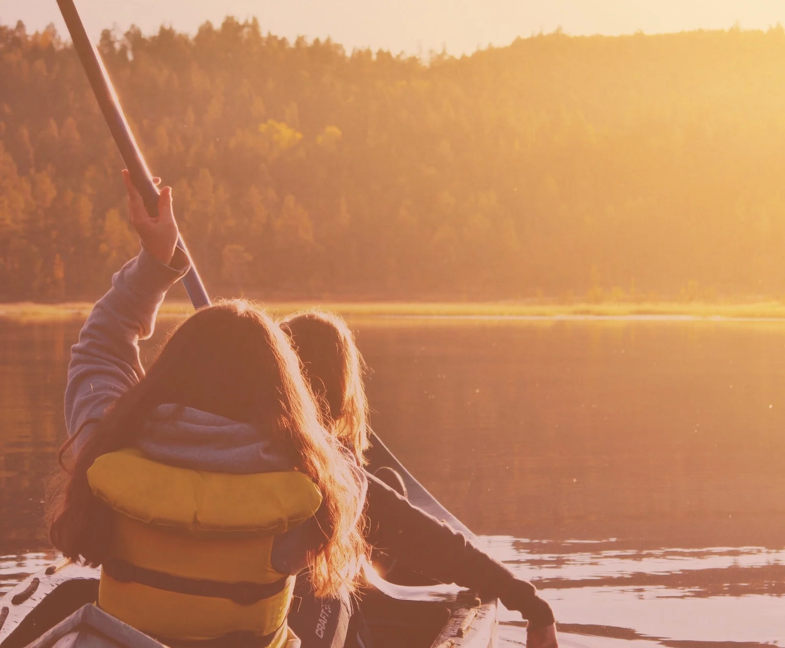 children canoeing on a lake.jpg