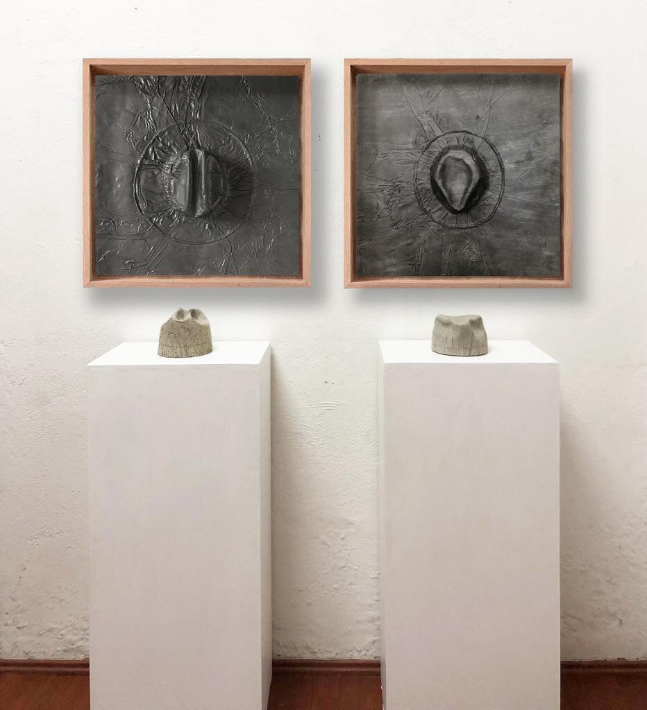  Gray Matter, 2019 (Diptych)  2 Hats Belonging to My Father (1905-1978) Embossed in Lead, and 2 Concrete Casts of the Inside of the Hats   84” x 65” x 24”    Materia gris”,2019   Un Sombrero de Mi Padre (1905 – 1978) y Uno Mío Repujados en Plomo y Do