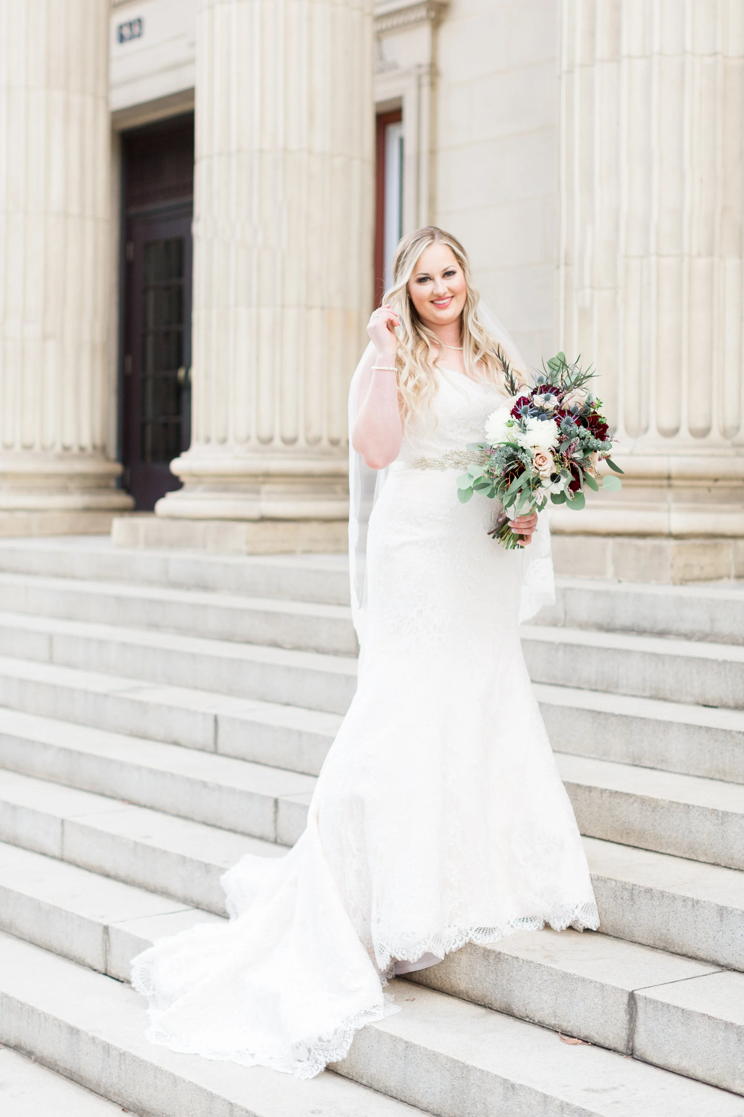 bride-takes-solo-photos-in-front-of-sf-city-hall-wedding(3 of).jpg