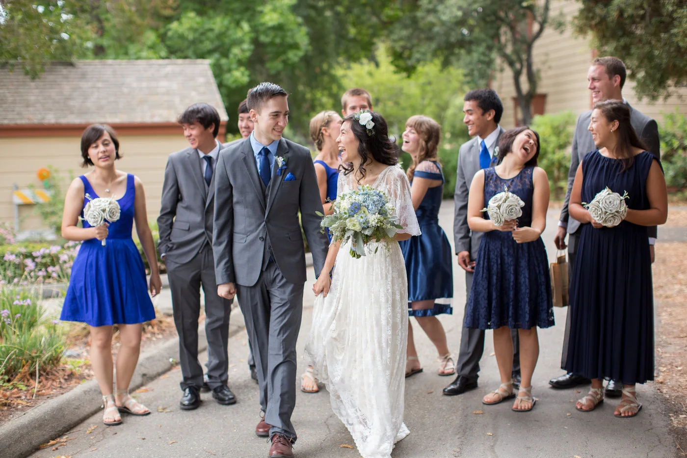 couple-walks-together-for-photos-on-wedding-day.jpg