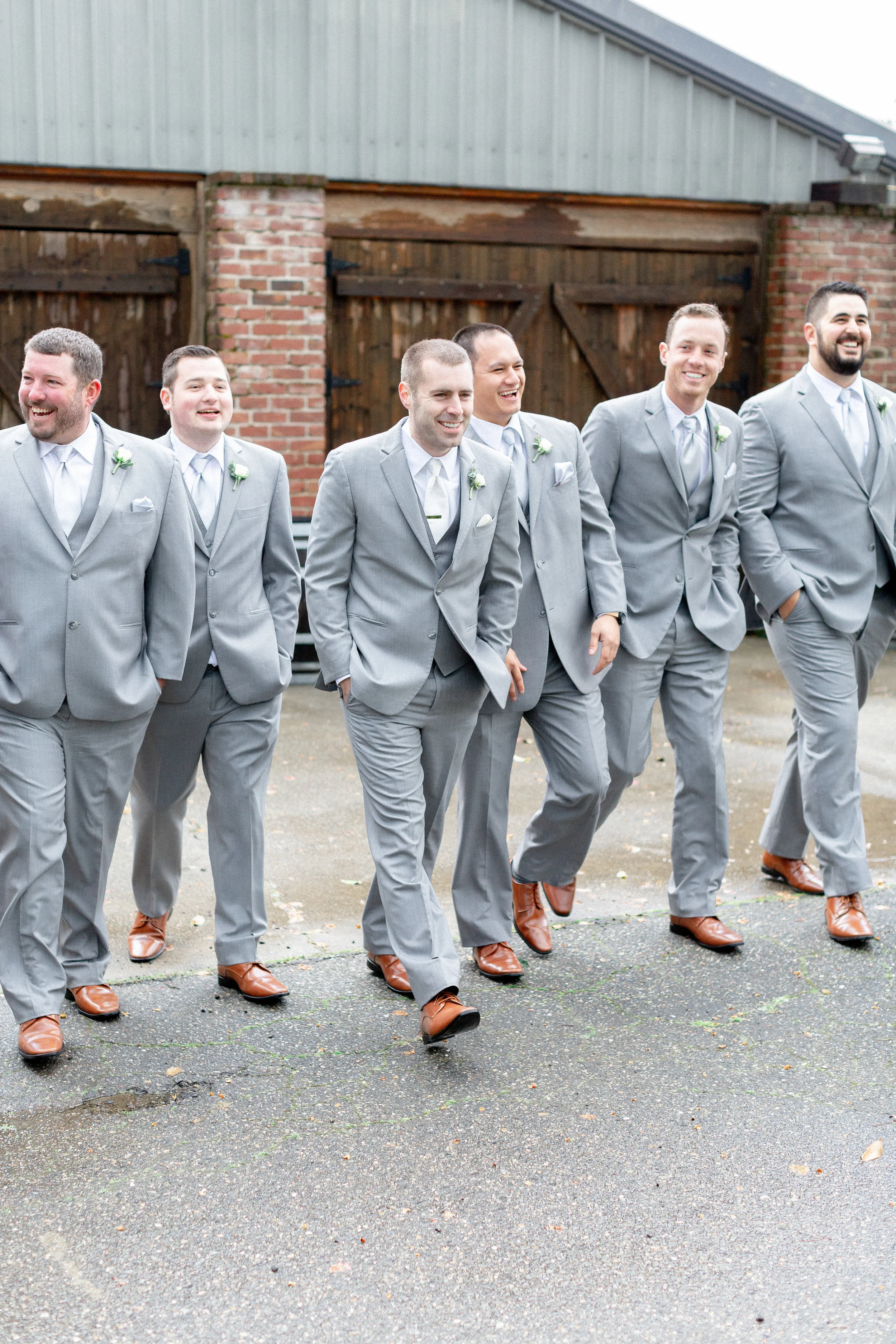 groomsmen-walking-photos-in-gray-suites.jpg