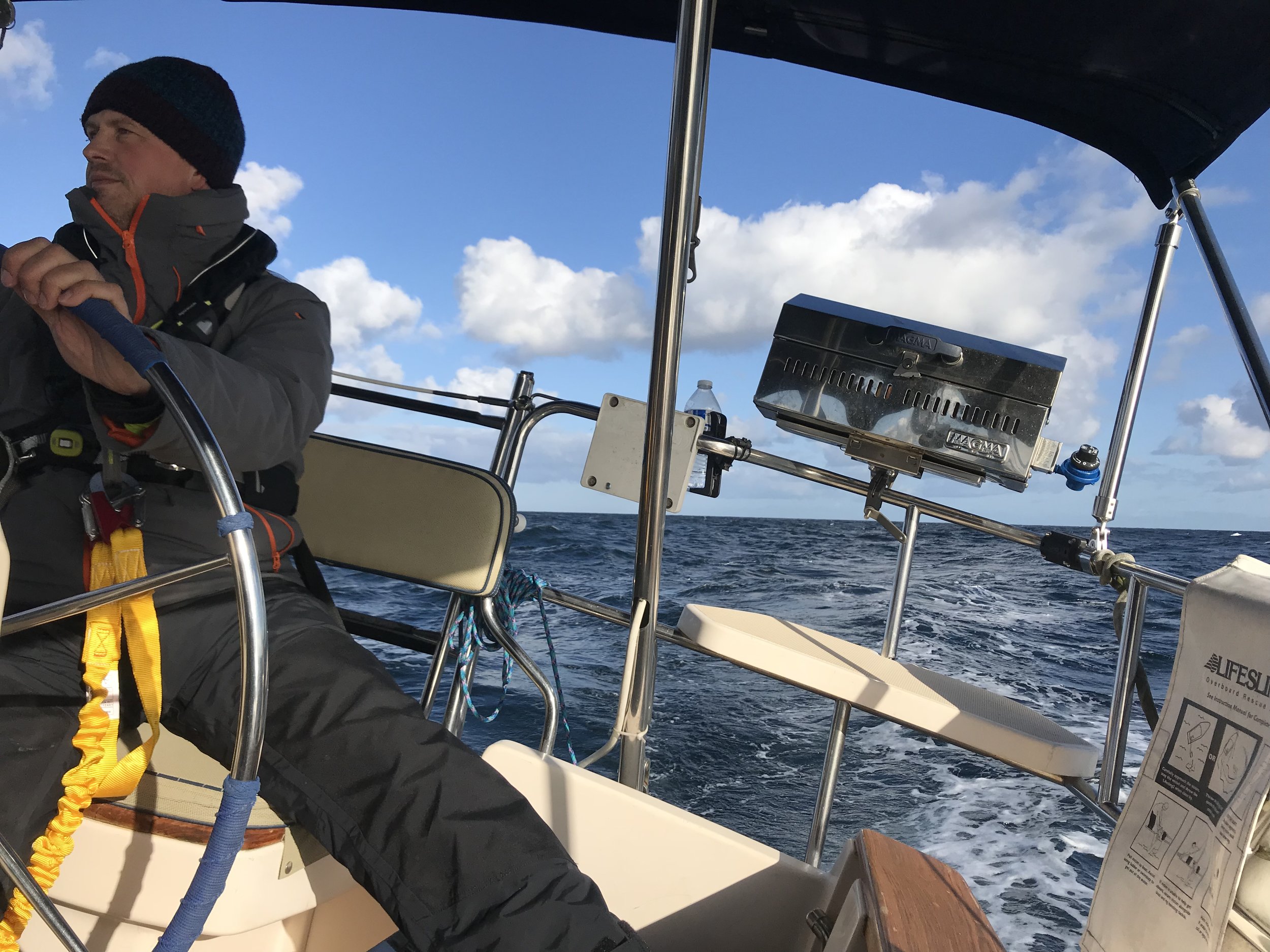 Two hands on the helm.