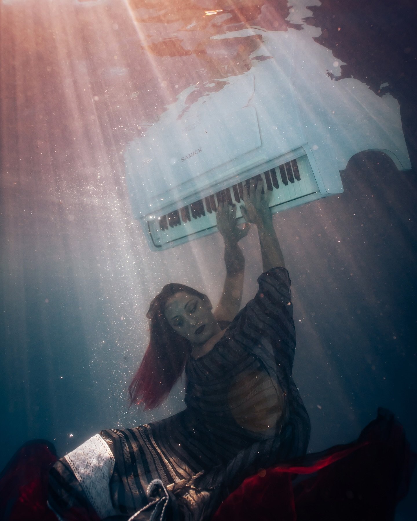 Working on my music website and came across this photo
I have such a rediscovered appreciation for it -the sunlight perfectly seeping into the water- Martha literally sending me into the deep end with the piano floating above me- the flares of light 