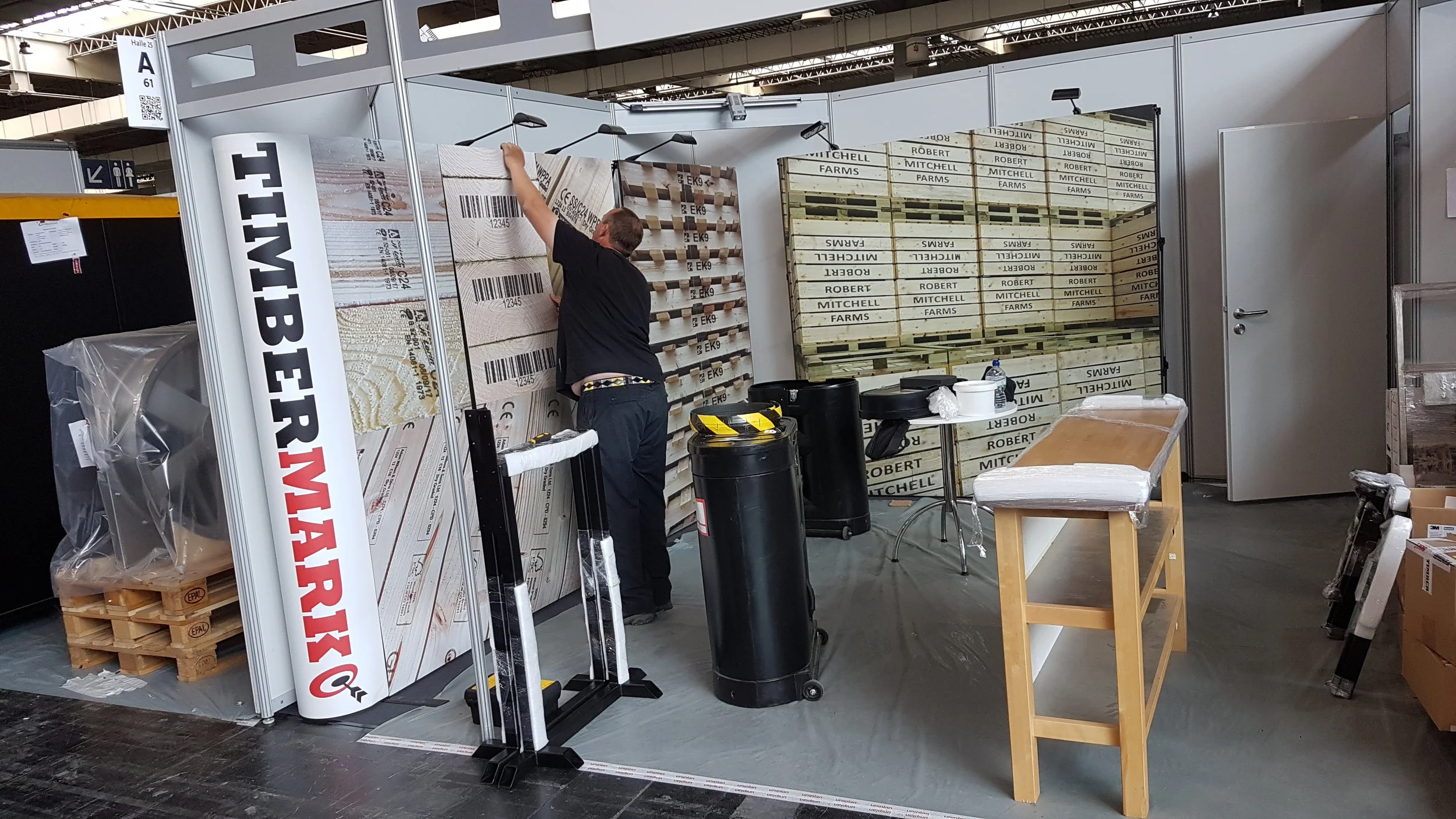 Putting the finishing touches to our stand at the exhibition