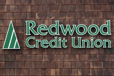 Redwood Credit Union signage on wood wall