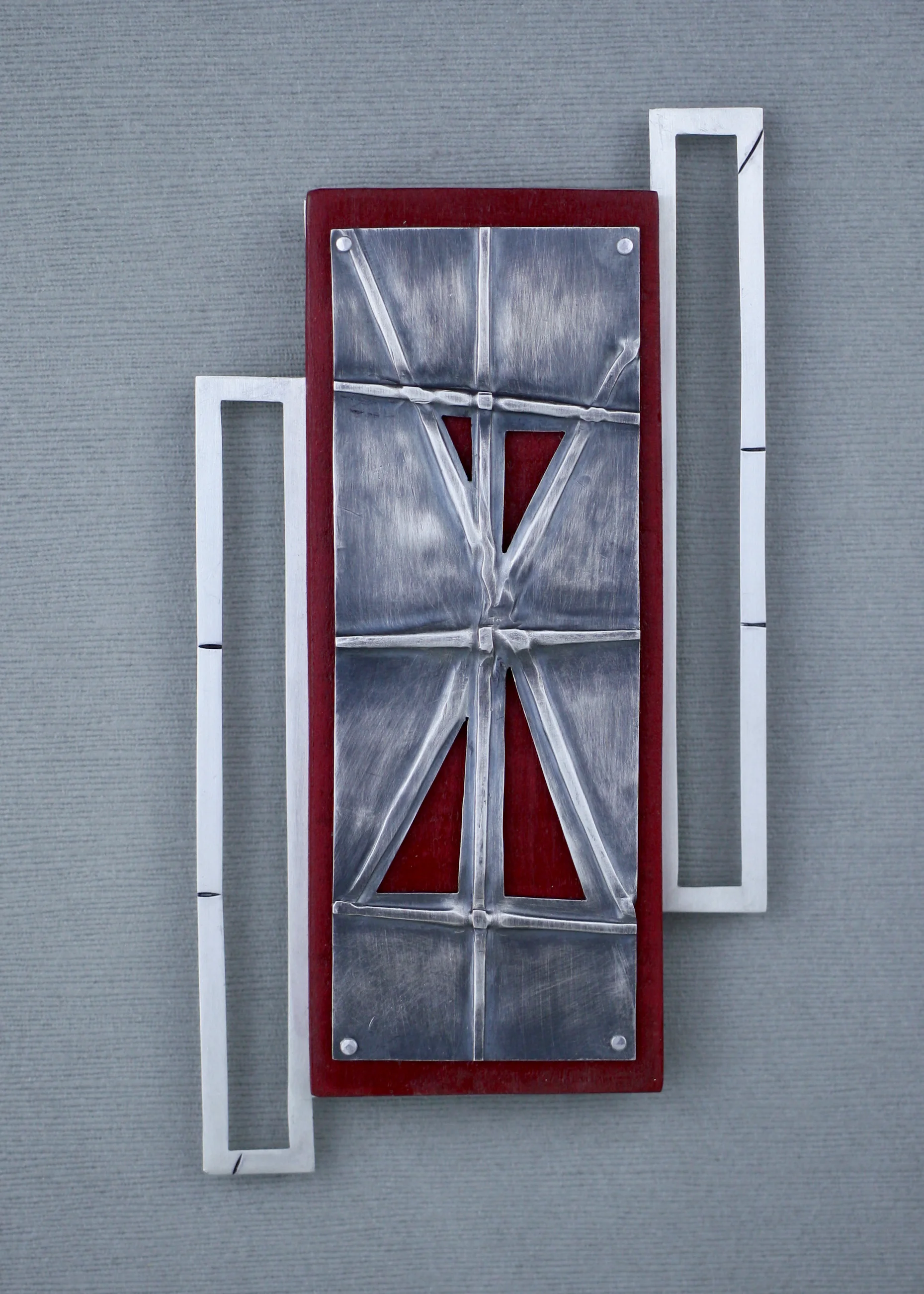 Separation, 2019. Brooch - sterling silver, cherry wood, stainless steel. 6 IN x 3 IN x 0.75 IN