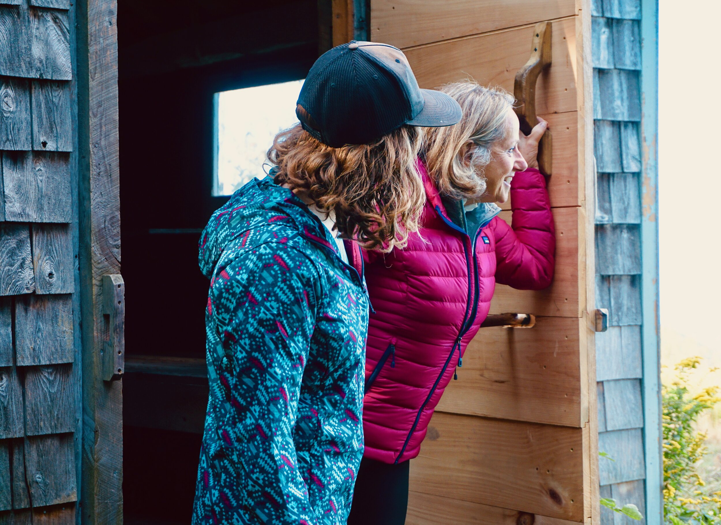 Left to Right: Women’s Patagonia Icefall: Smolder Blue Houdini Jacket, Prana Vintage Blue Heather Foundation Long Sleeve Crew Neck (baselayer), and Patagonia Craft Pink Down Sweater