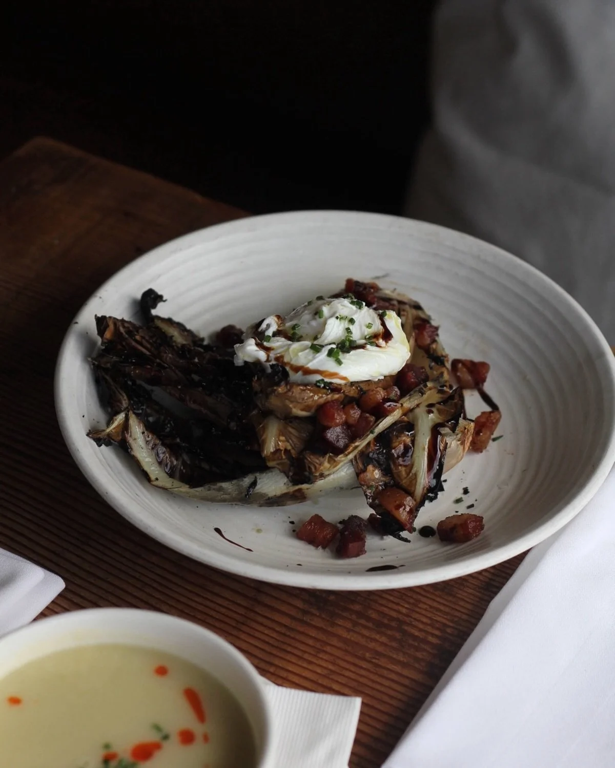 This is the last weekend for our spring menu, so spend this rainy Friday over a cozy Tuscan table with us. Order this grilled radicchio with pancetta and a farm egg while youre at it!