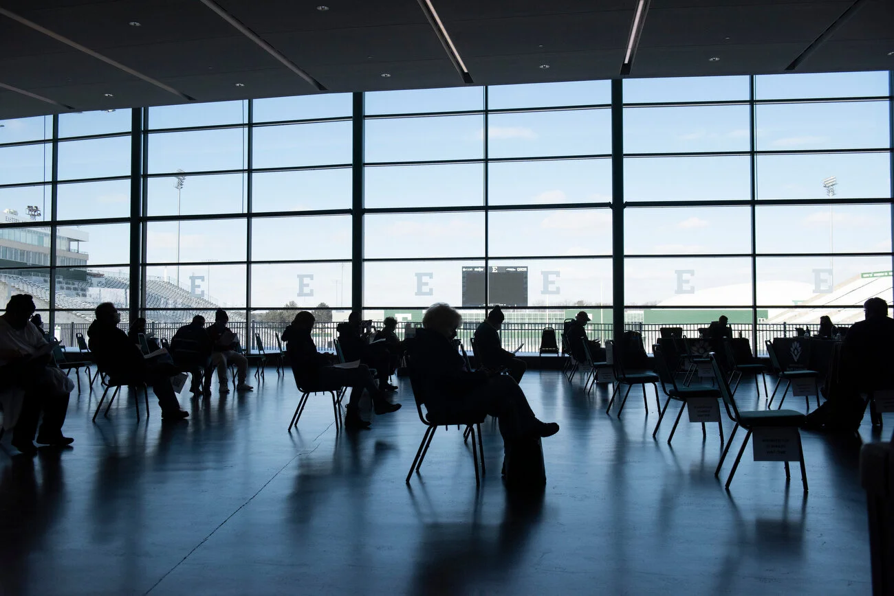  After receiving the COVID-19 vaccine, people wait the required 15-30 minutes before leaving the vaccination clinic at Eastern Michigan University Convocation Center in Ypsilanti on Tuesday, Feb. 9, 2021. 