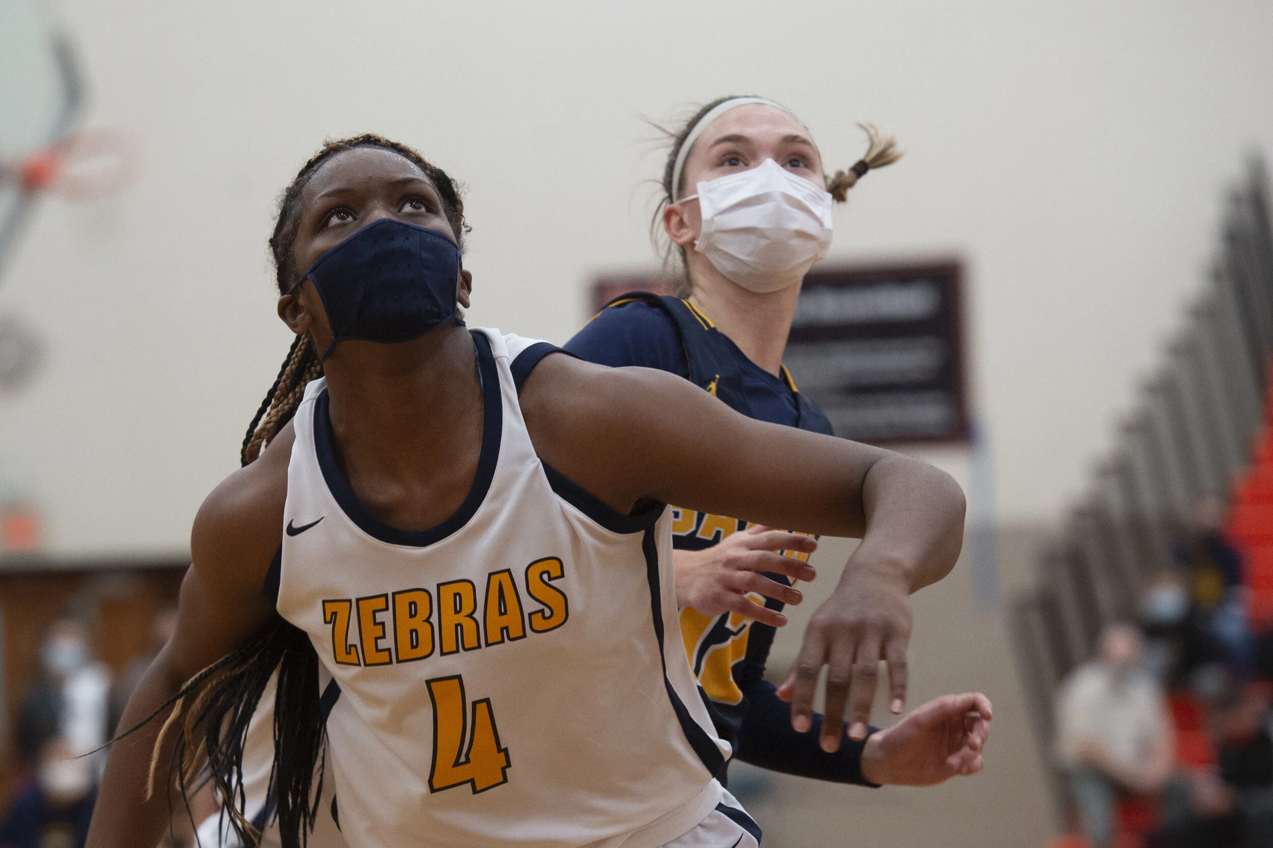  Wayne Memorial's Alanna Micheaux (4) boxes out Saline’s Ella Stemmer (12) during the regional finals at Northville High School on Wednesday, March 31, 2021. It was a tough game for the sister’s team. The Saline girls never gave up, but they were def