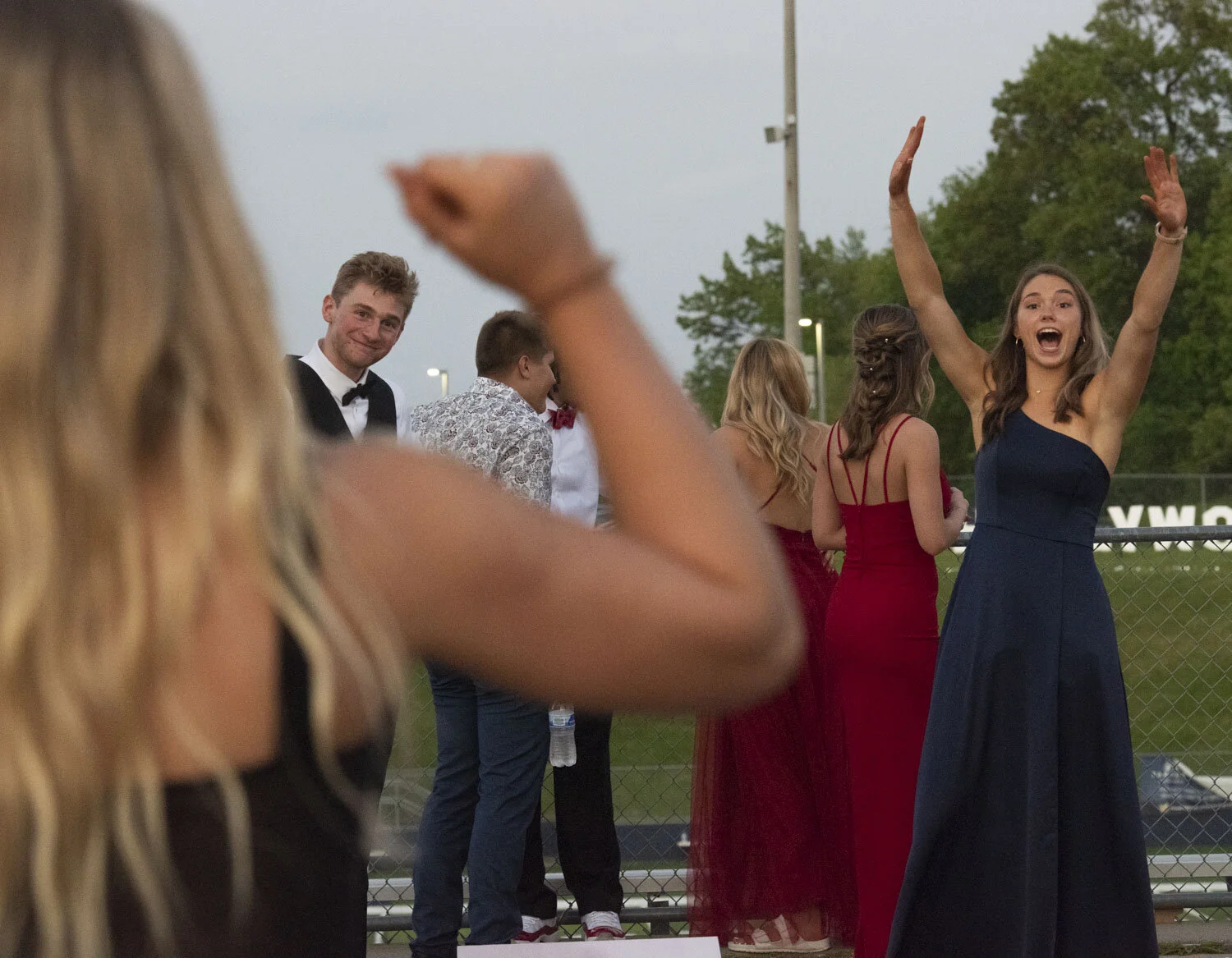  Ella Stemmer, right, cheers as her friend Josie Bero makes a bean bag toss onto the board during prom at Saline High School on Saturday, May 22, 2021. Stemmer enjoys this last night with friends as tomorrow she starts her college career on the Lehig