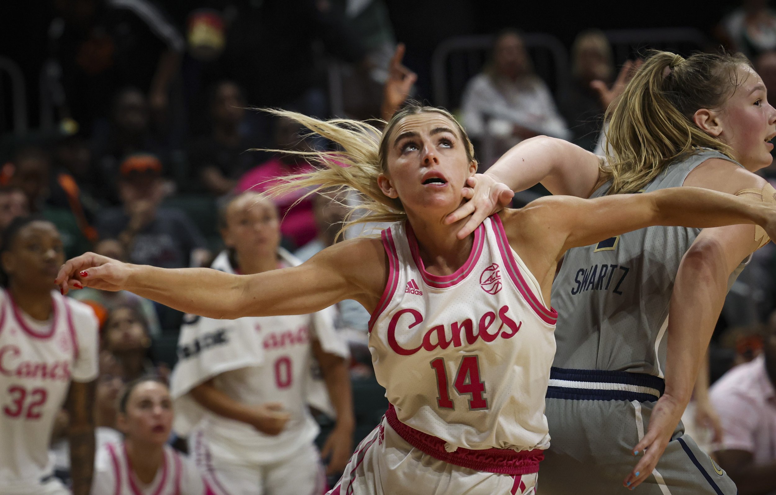  Hurricane's Haley Cavinder (14) gets boxed out by Georgia Tech’s Cameron Swartz (1) during the third quarter of a NCAA game between the Miami Hurricanes and Georgia Tech on Sunday, Feb. 5, 2023 at the Watsco Center in Coral Gables. 