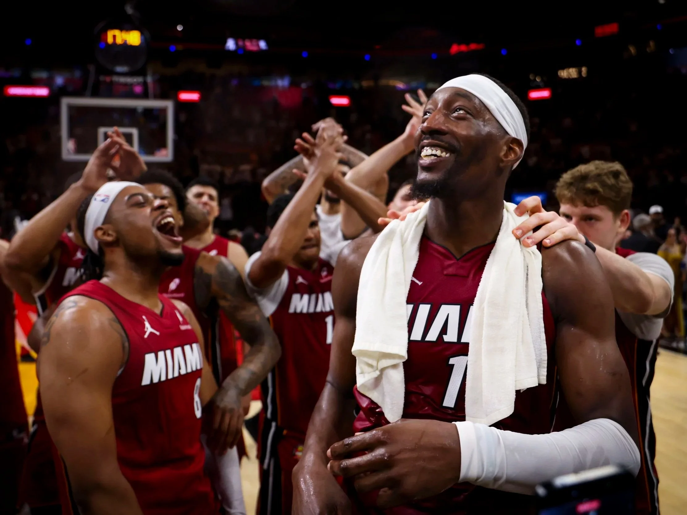 Miami Heat center Bam Adebayo (13) looks up to the sky while celebrating with teammates after he scored 83 points against the Washington Wizards, marking the second-highest single-game point total in NBA history, on Tuesday, March 10, 2026, at Kaseya