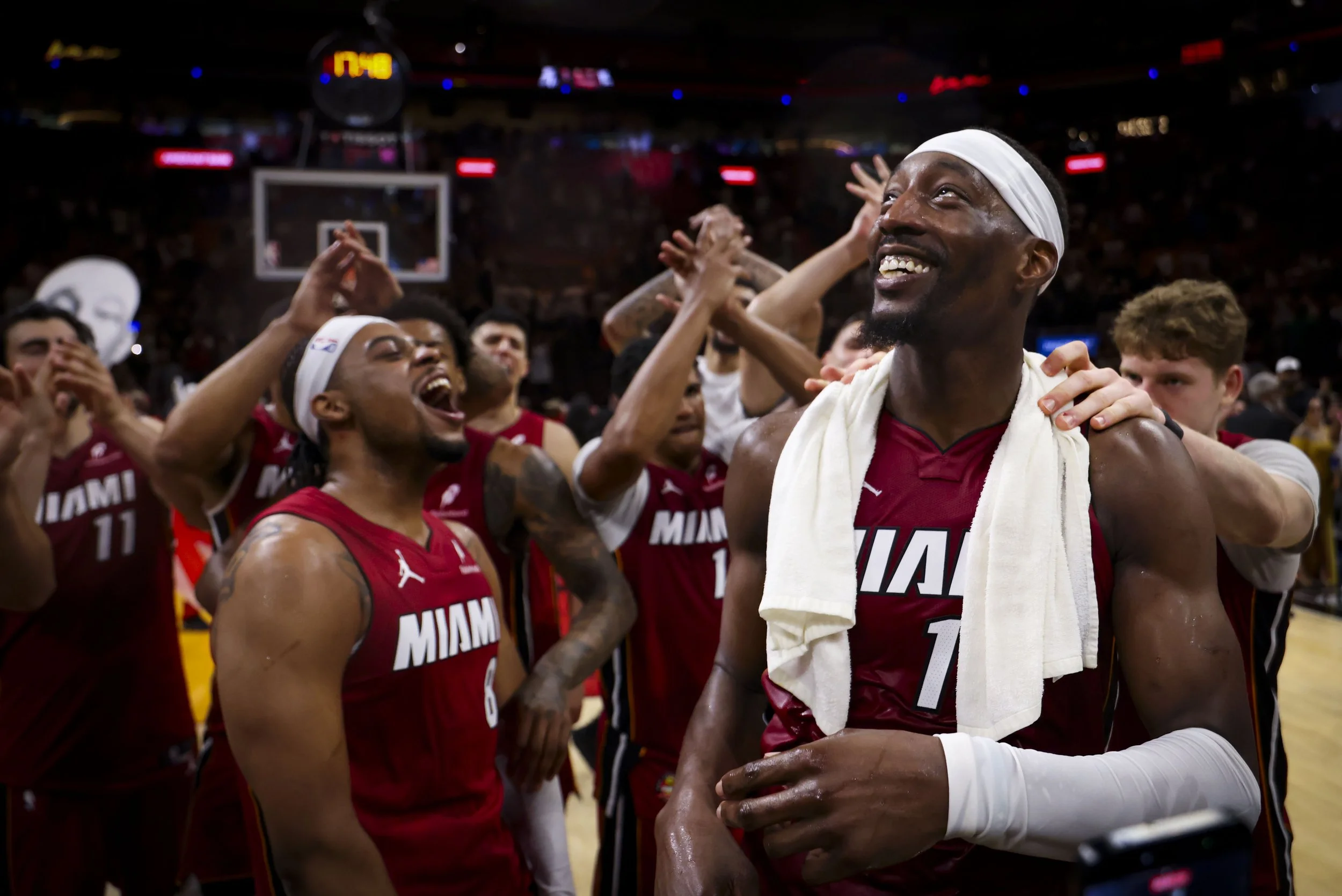 Miami Heat center Bam Adebayo (13) looks up to the sky while celebrating with teammates after he scored 83 points against the Washington Wizards, marking the second-highest single-game point total in NBA history, on Tuesday, March 10, 2026, at Kaseya