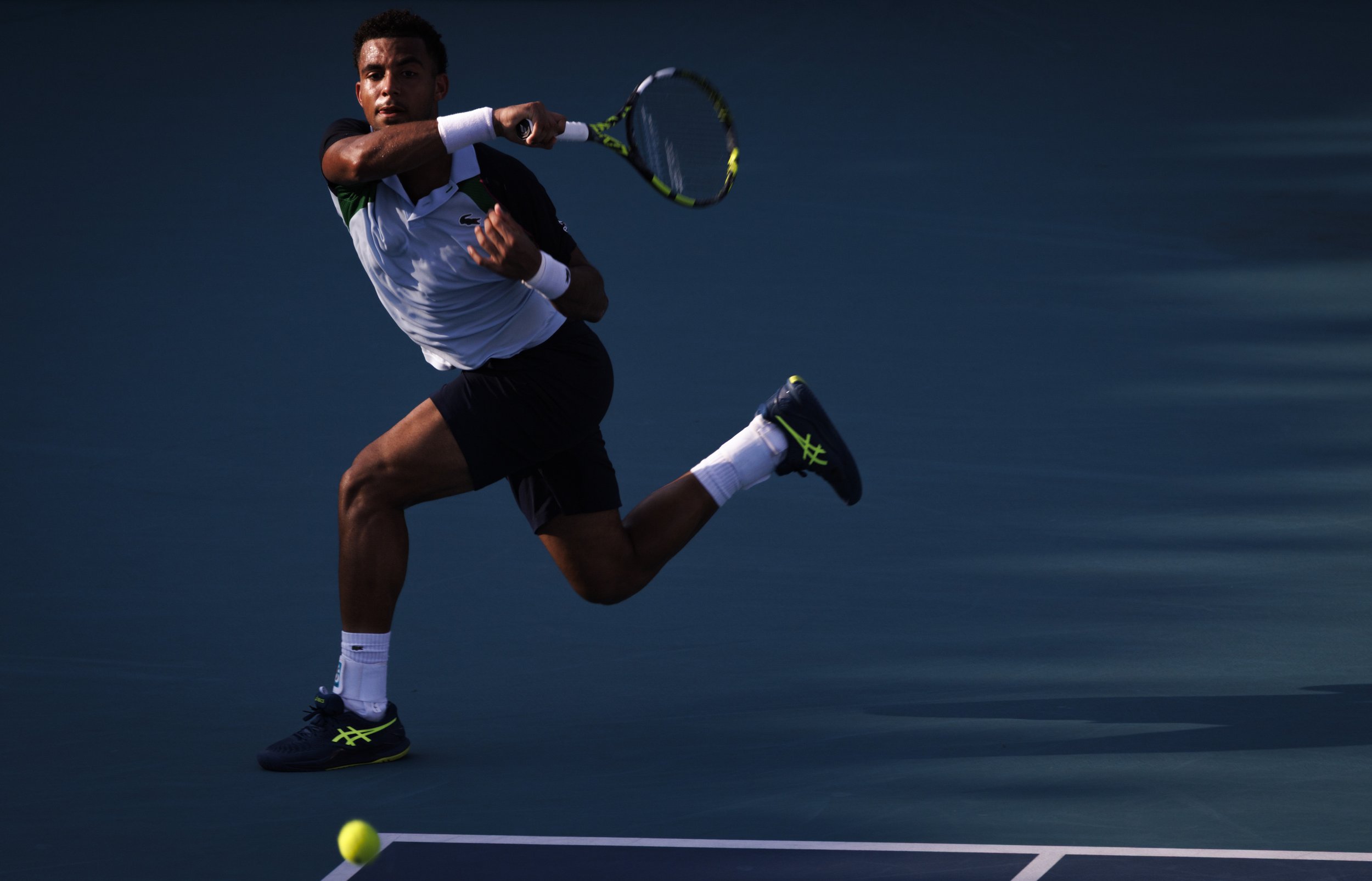 Arthur Fils (FRA) returns a serve by Frances Tiafoe (USA) during the Miami Open on Monday, March 24, 2025, at Hard Rock Stadium in Miami Gardens, Fla. Fils won the match.
