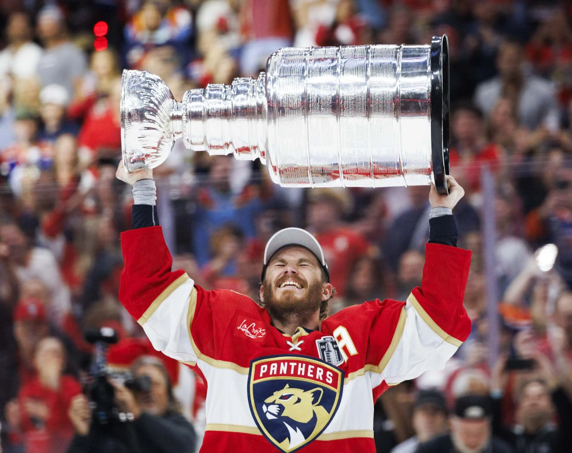 Florida Panthers left wing Matthew Tkachuk (19) lifts the Stanley Cup after the Florida Panthers won the Stanley Cup Final against the Edmonton Oilers at the Amerant Bank Arena on Tuesday, June 25, 2024 in Sunrise, Fla.