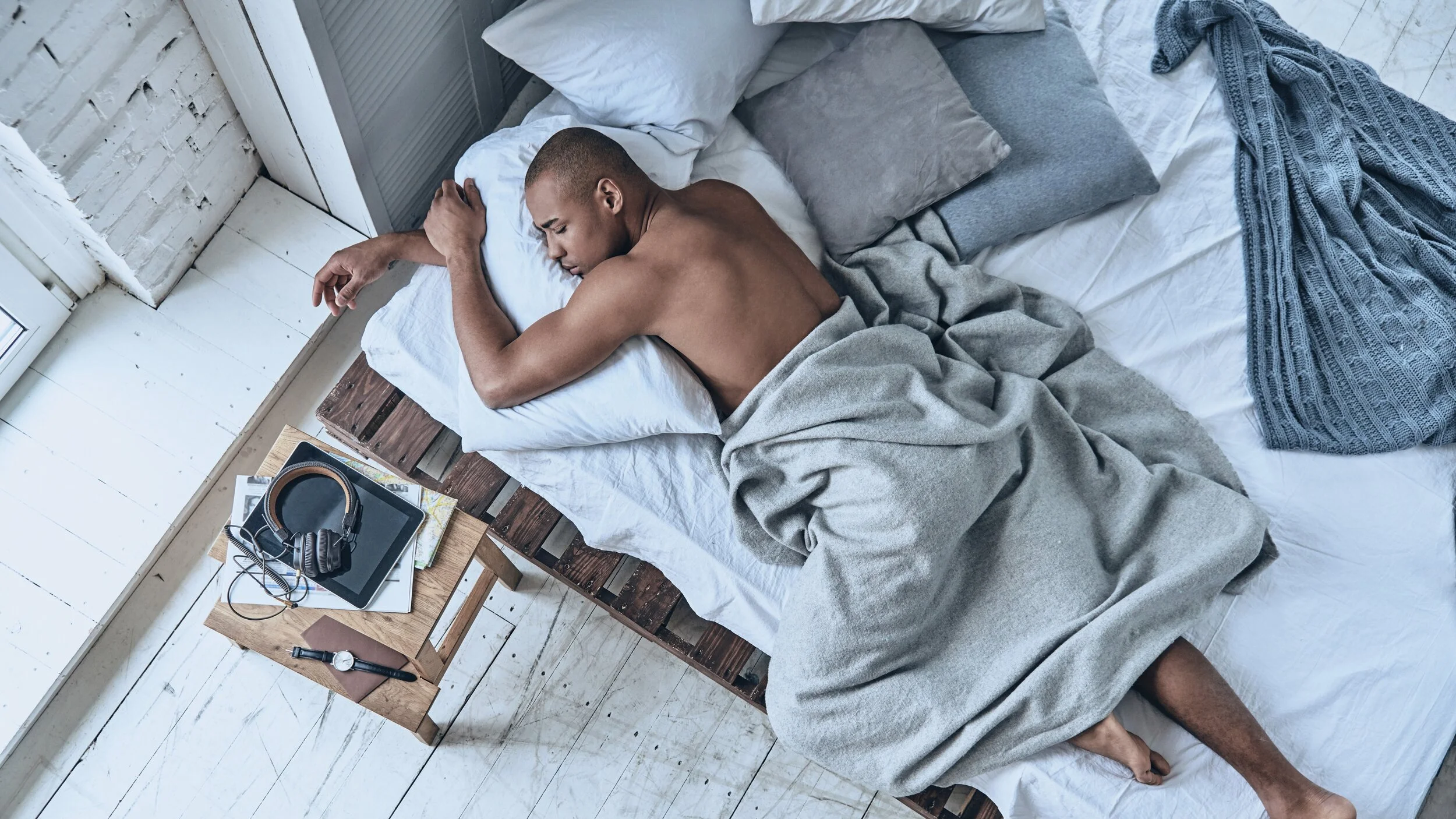 man-sleeping-while-lying-in-the-bed-at-home.jpg