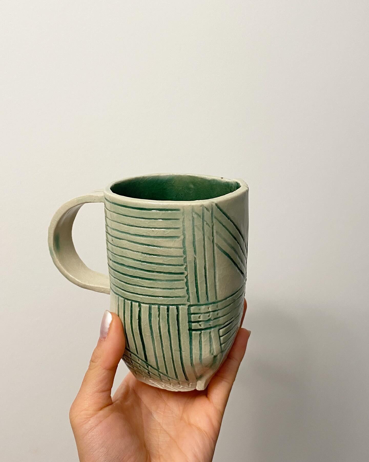 SOLD

This green beauty was a technical challenge. It was among the first few mugs I made with the origami construction technique. It was this mug that I got better with knowing when is the right dryness of slab clay to use. All the lines are hand-ca