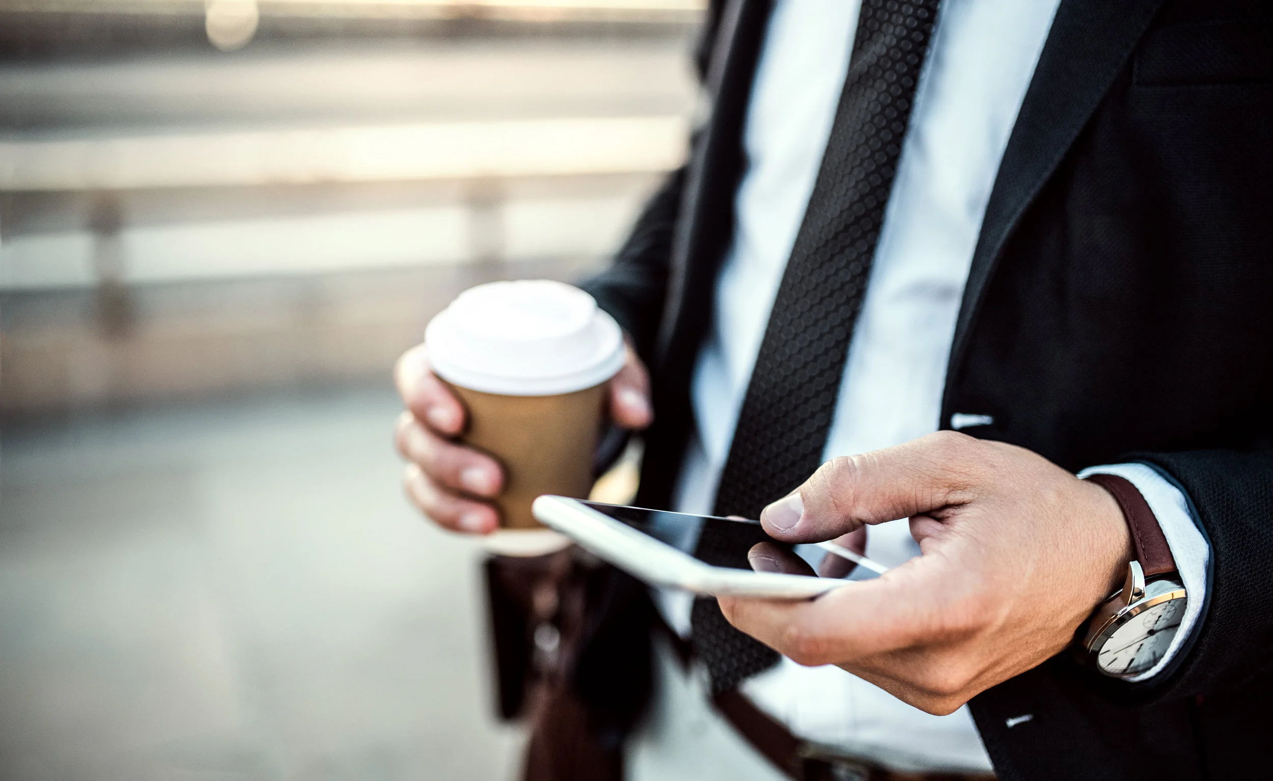 a-close-up-of-a-businessman-with-smartphone-and-89MRN2Z.jpg