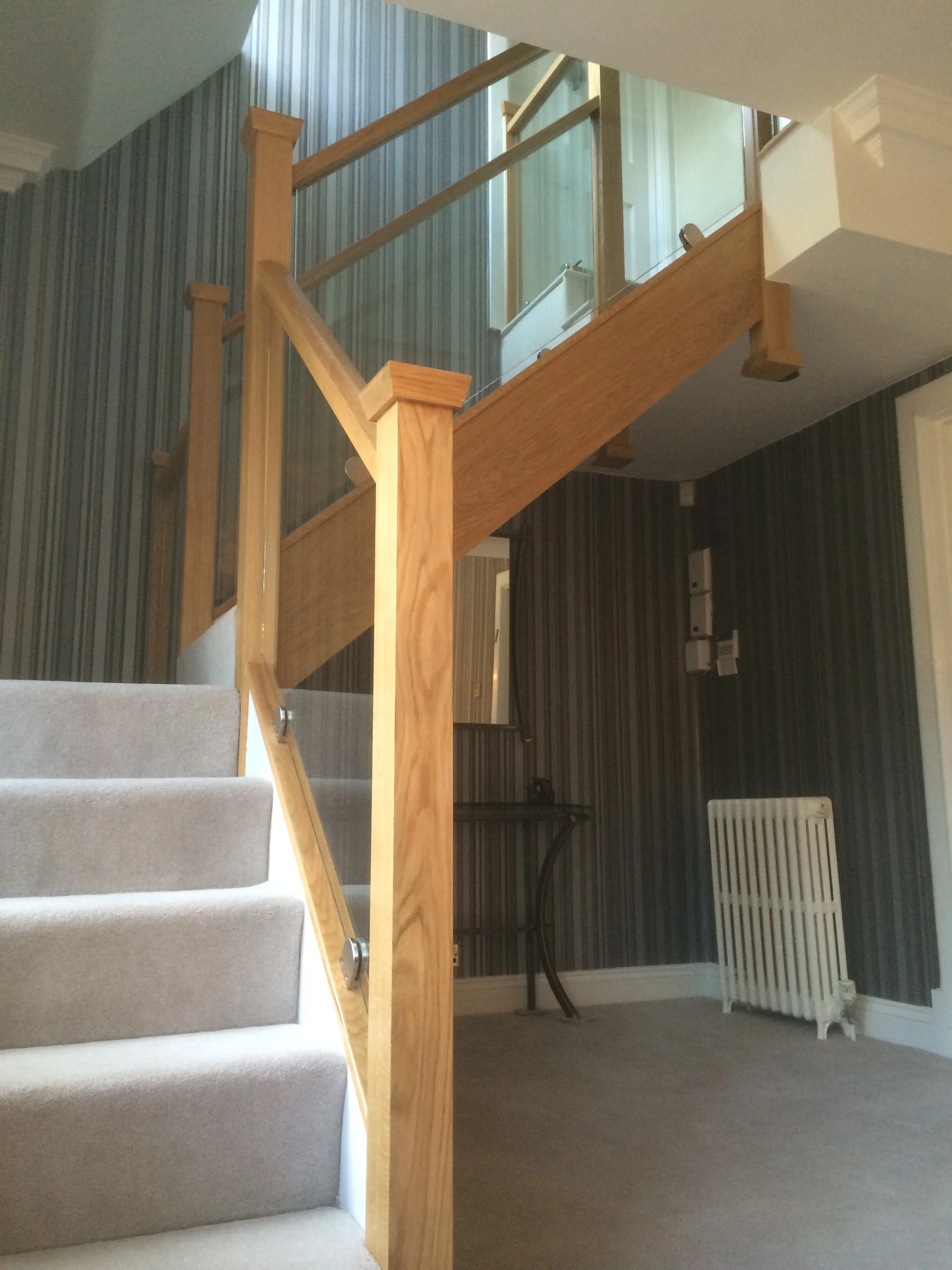 Glass stair balustrade with Oak hand rail in St Albans