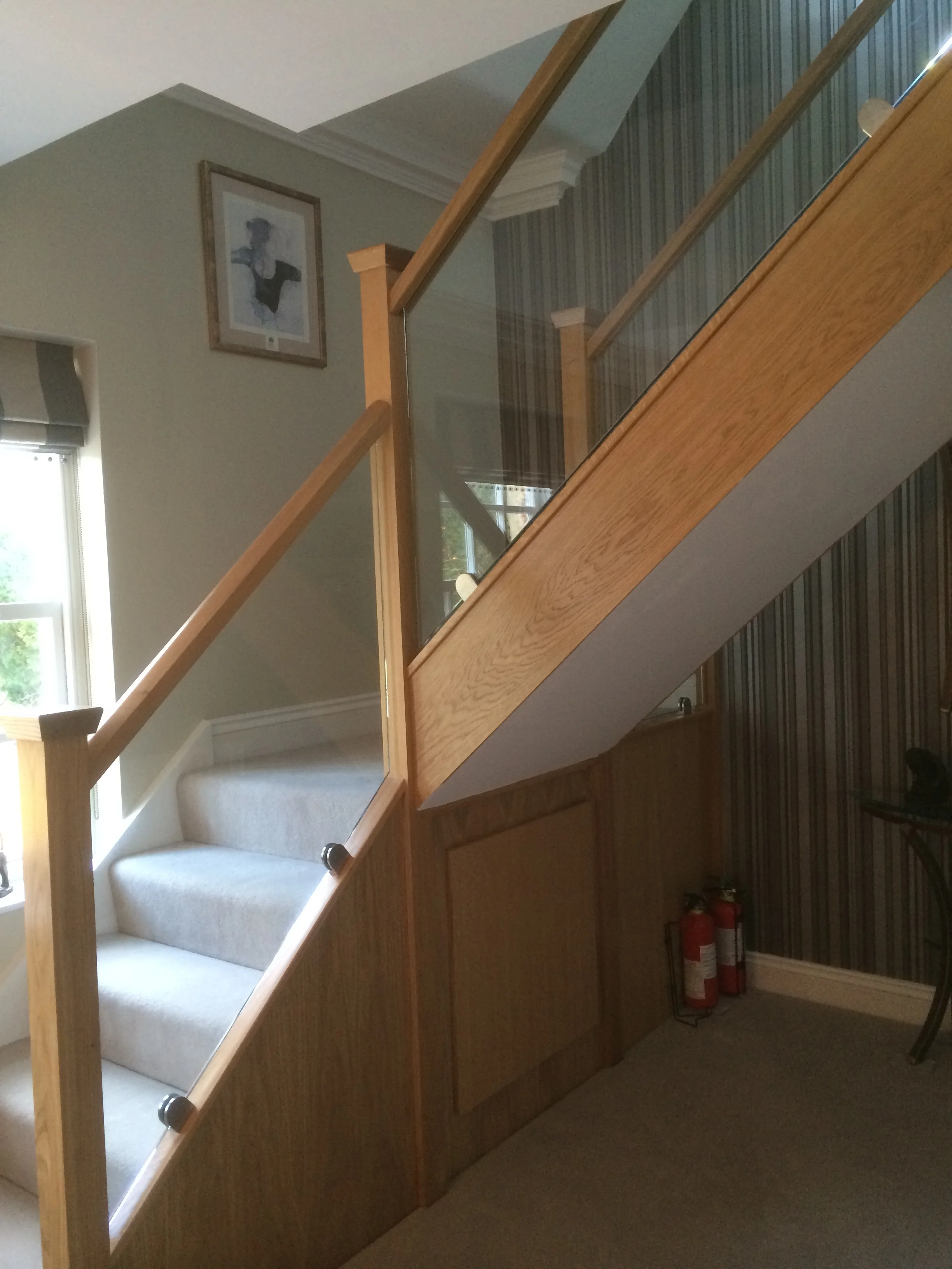 Glass stair balustrade with oak hand rail in St Albans