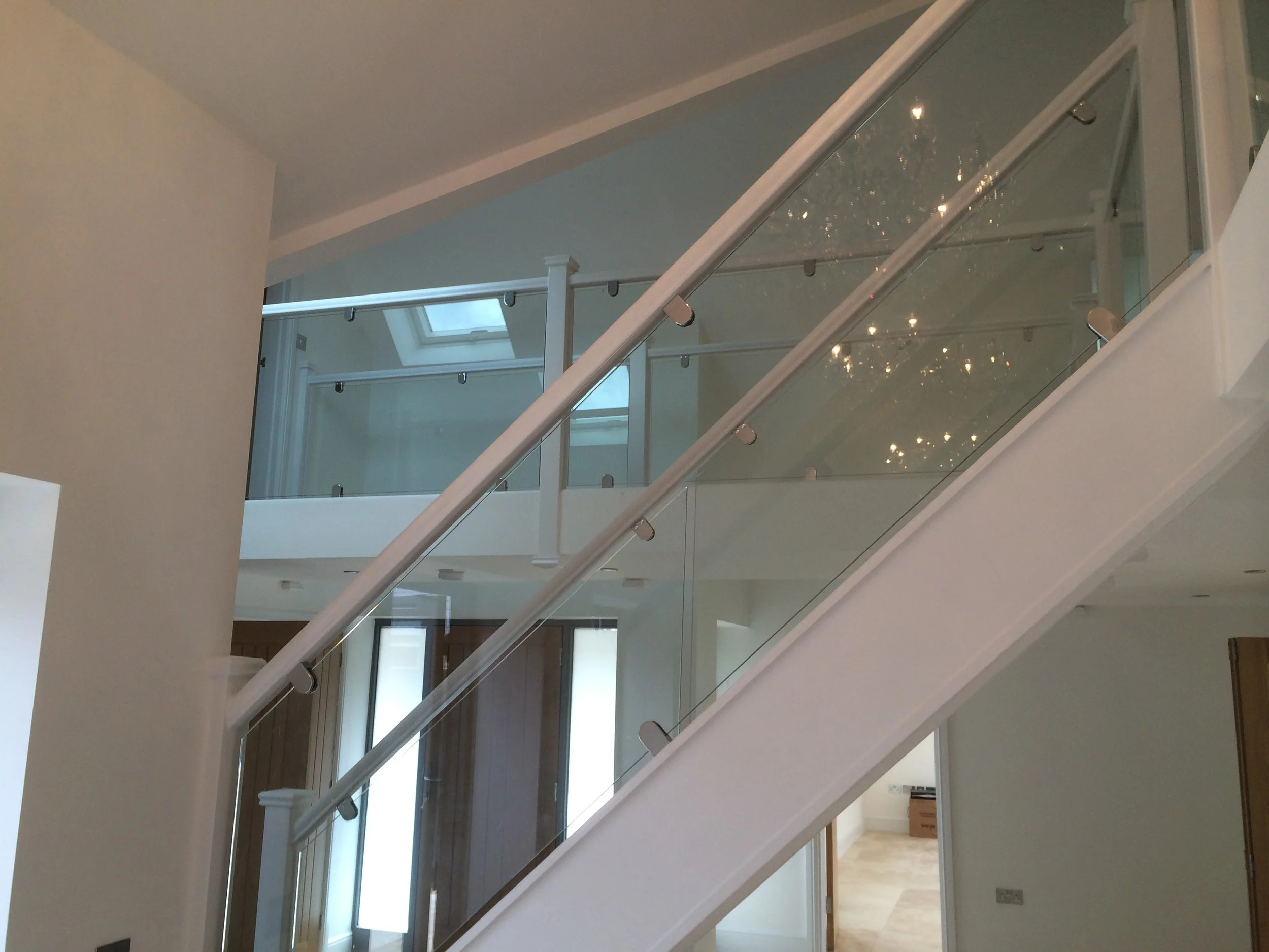 Glass stair case with white frame