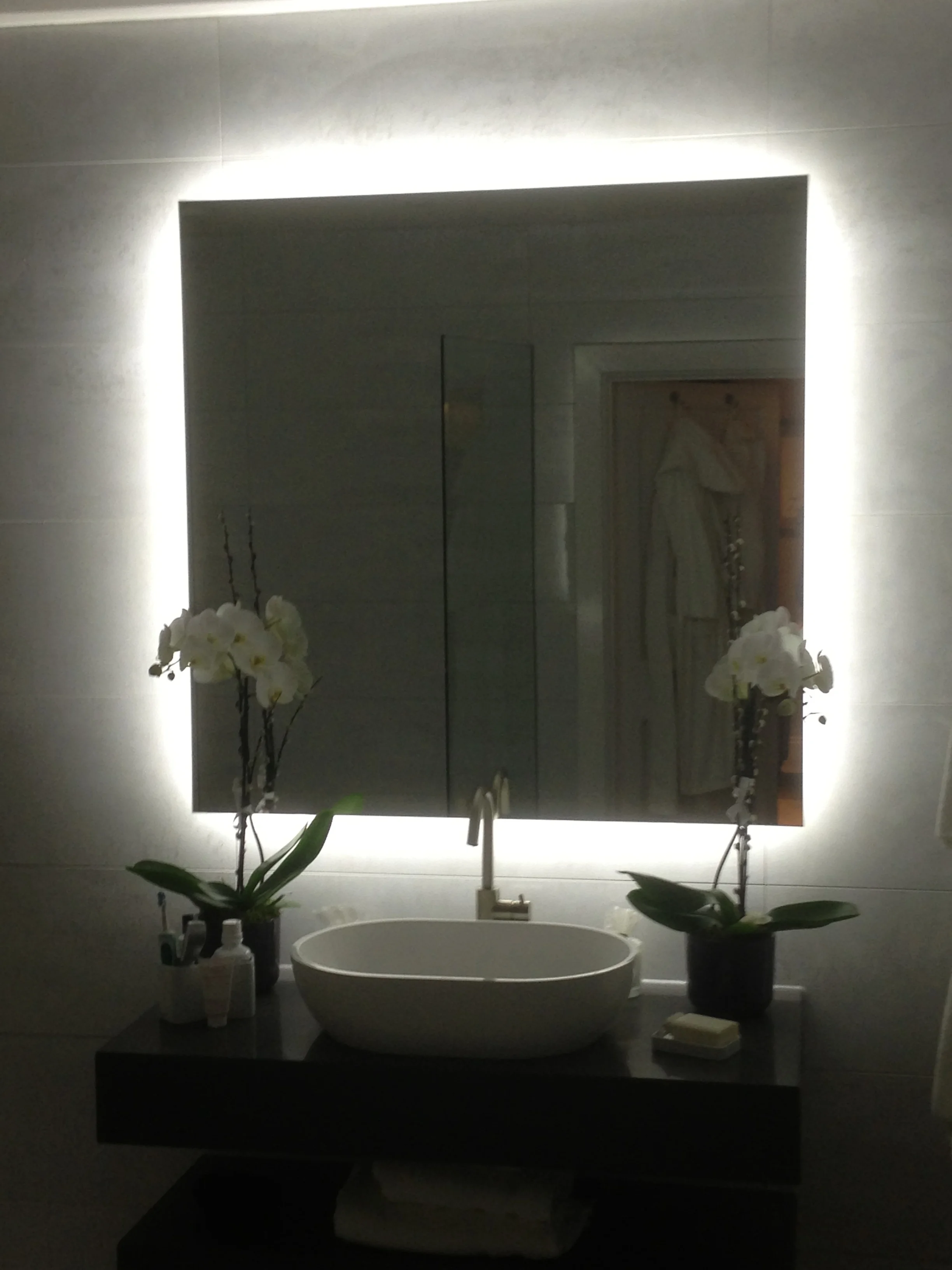 Back-lit bathroom mirror by The GlassSmith 