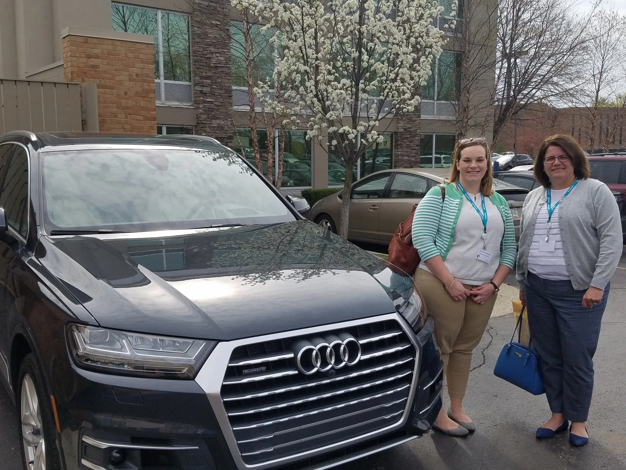 Corrine and Laurie after participating in the Vehicle-To-Infrastructure Demo. This demo showcased how the Audi connected to traffic Infrastructure.