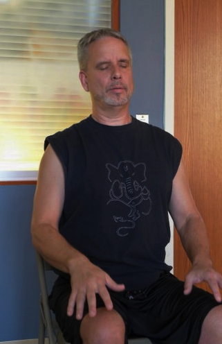 Mross leads meditation at the close of the class at Upland Hills Health in Dodgeville, Wisconsin. DAVID TENENBAUM, UNIVERSITY COMMUNICATIONS