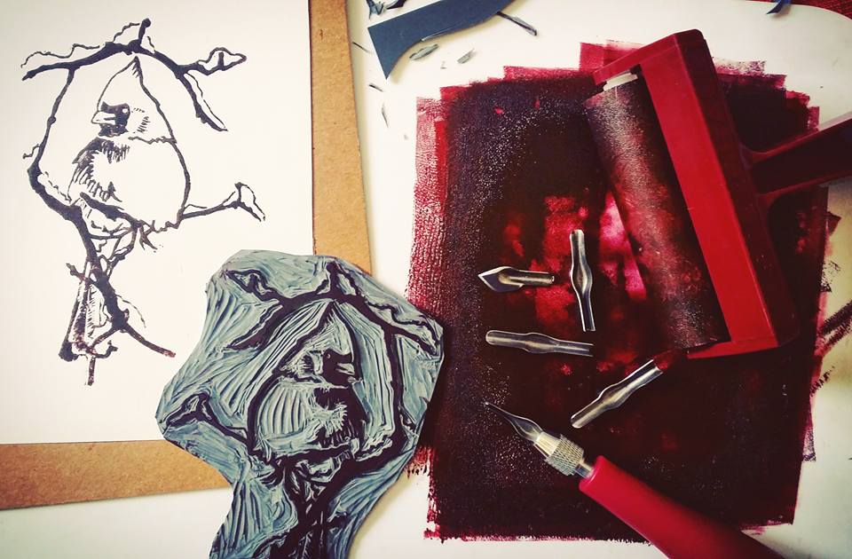 Cardinal print with stamp, ink, and linocut gouging tips.